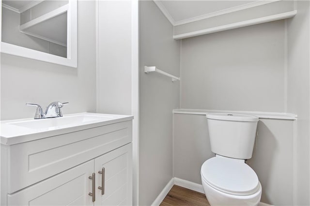 11016 W 96th Ter, Overland Park, KS 66214 - half bathroom featuring crown molding, vanity, and wood finished floors