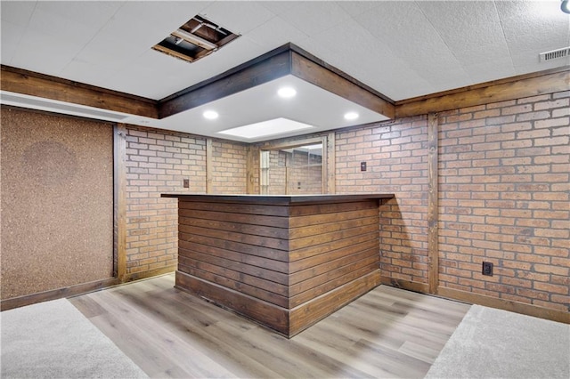 11016 W 96th Ter, Overland Park, KS 66214 - indoor dry bar with brick wall and wood finished floors