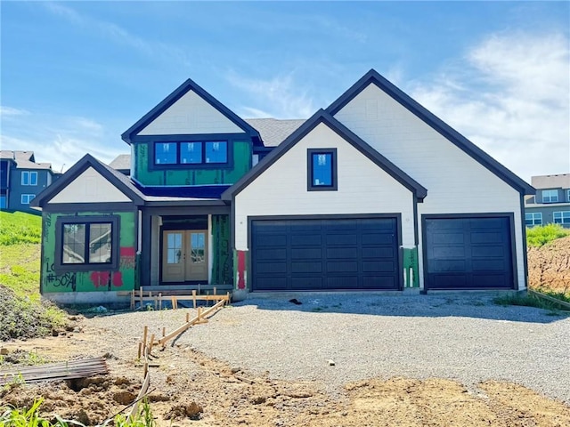 9785 Ambrosia Ln, Parkville, MO 64152 - view of front of home featuring driveway and french doors