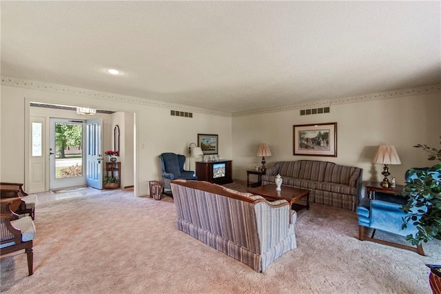 205 E 10th St, Carrollton, MO 64633 - living area with light carpet and a textured ceiling