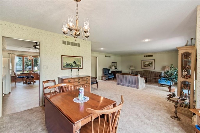 205 E 10th St, Carrollton, MO 64633 - dining area with a chandelier, light colored carpet, ceiling fan, and crown molding