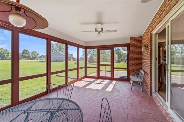 205 E 10th St, Carrollton, MO 64633 - unfurnished sunroom featuring a ceiling fan