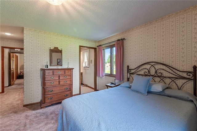205 E 10th St, Carrollton, MO 64633 - bedroom with light carpet, a textured ceiling, and wallpapered walls