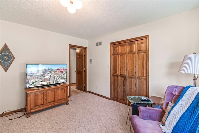 205 E 10th St, Carrollton, MO 64633 - sitting room featuring light colored carpet and a textured ceiling