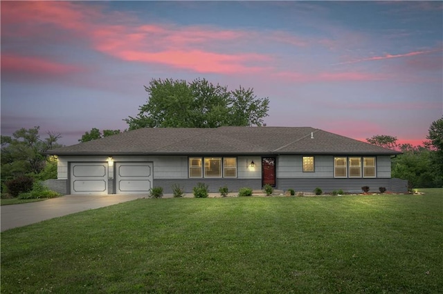 2517 Red Bridge Ter, Kansas City, MO 64131 - ranch-style home featuring driveway, a garage, and a front lawn