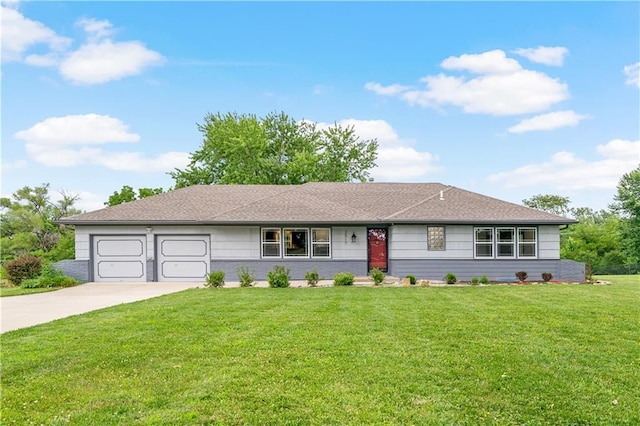 2517 Red Bridge Ter, Kansas City, MO 64131 - single story home with concrete driveway, an attached garage, and a front lawn