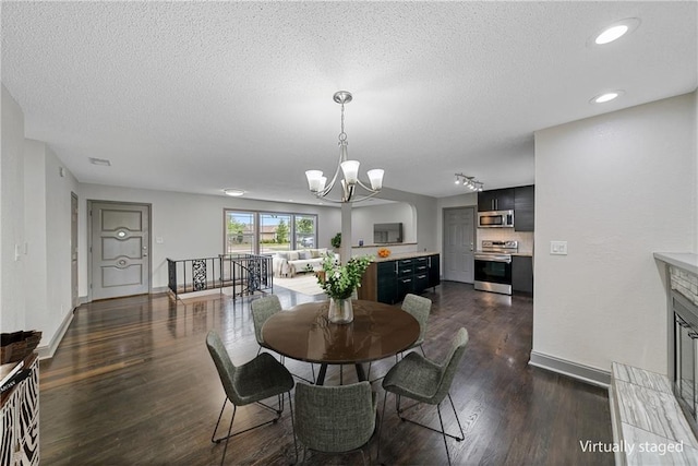 2517 Red Bridge Ter, Kansas City, MO 64131 - dining space featuring a chandelier, a textured ceiling, dark wood-style floors, and recessed lighting