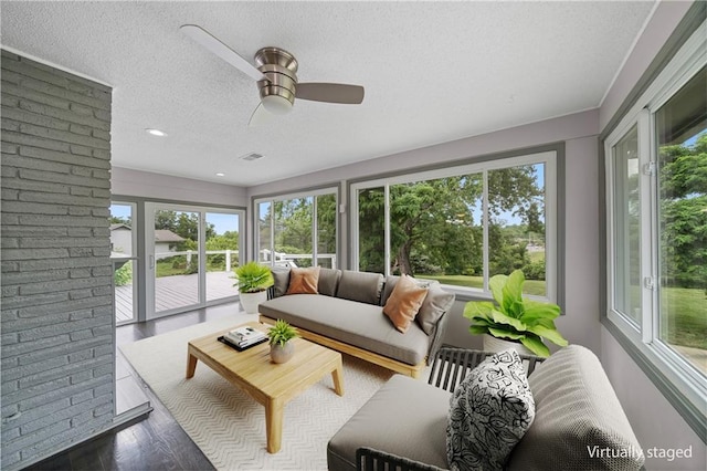 2517 Red Bridge Ter, Kansas City, MO 64131 - sunroom with a textured ceiling, a ceiling fan, wood finished floors, an outdoor hangout area, and recessed lighting
