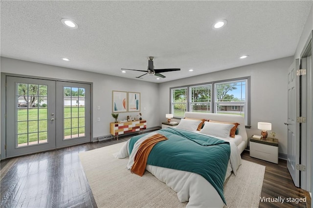 2517 Red Bridge Ter, Kansas City, MO 64131 - bedroom with access to outside, french doors, multiple windows, dark wood finished floors, and a textured ceiling