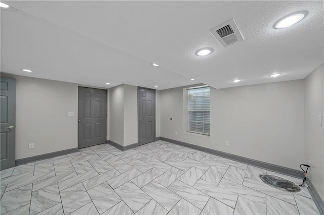 2517 Red Bridge Ter, Kansas City, MO 64131 - finished basement with a textured ceiling and recessed lighting