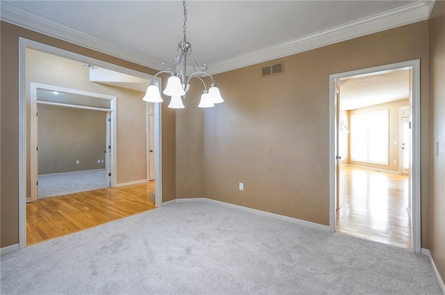 12337 Gillette St, Overland Park, KS 66213 - carpeted empty room featuring a chandelier and crown molding