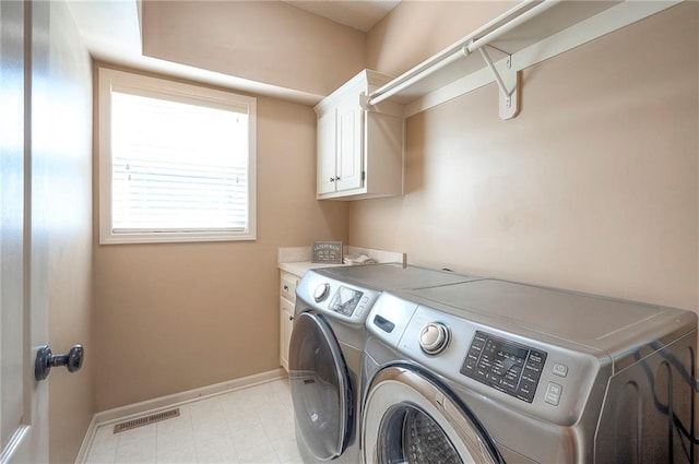 12337 Gillette St, Overland Park, KS 66213 - washroom with washer and dryer and cabinet space