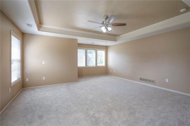 12337 Gillette St, Overland Park, KS 66213 - carpeted empty room with a raised ceiling, a textured ceiling, ceiling fan, and crown molding