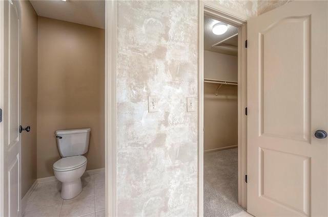 12337 Gillette St, Overland Park, KS 66213 - bathroom featuring toilet and tile patterned flooring