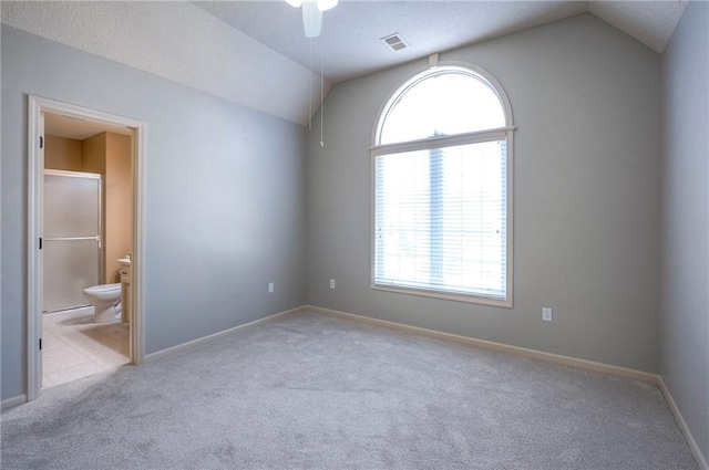 12337 Gillette St, Overland Park, KS 66213 - empty room featuring vaulted ceiling, carpet flooring, healthy amount of natural light, ceiling fan, and a textured ceiling