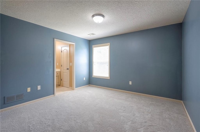 12337 Gillette St, Overland Park, KS 66213 - spare room featuring carpet and a textured ceiling