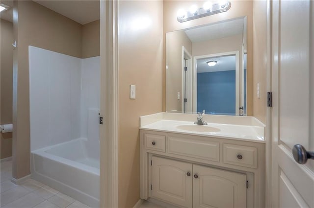 12337 Gillette St, Overland Park, KS 66213 - bathroom with tile patterned flooring, vanity, and tub / shower combination