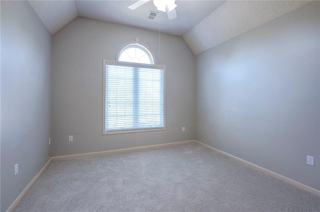 12337 Gillette St, Overland Park, KS 66213 - carpeted spare room featuring a ceiling fan, lofted ceiling, and a textured ceiling