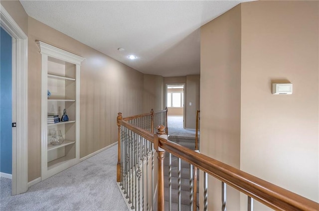 12337 Gillette St, Overland Park, KS 66213 - corridor featuring an upstairs landing, carpet flooring, and built in shelves