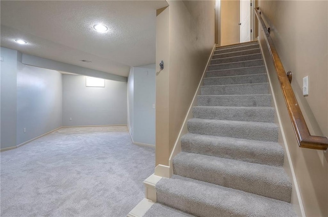 12337 Gillette St, Overland Park, KS 66213 - stairs featuring a textured ceiling, carpet flooring, and recessed lighting