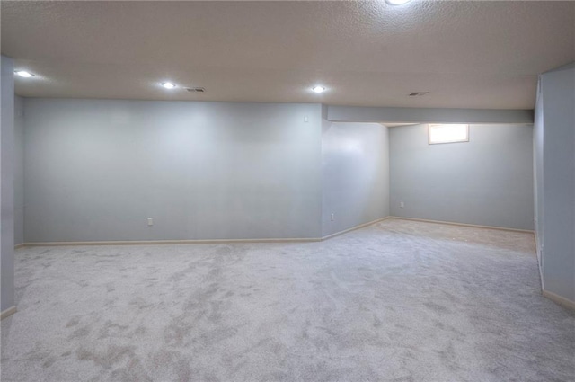 12337 Gillette St, Overland Park, KS 66213 - below grade area with carpet floors, a textured ceiling, and recessed lighting