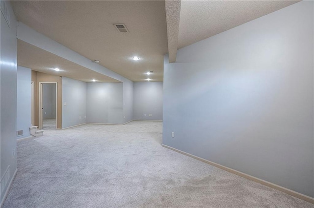 12337 Gillette St, Overland Park, KS 66213 - finished below grade area featuring light colored carpet, recessed lighting, and a textured ceiling