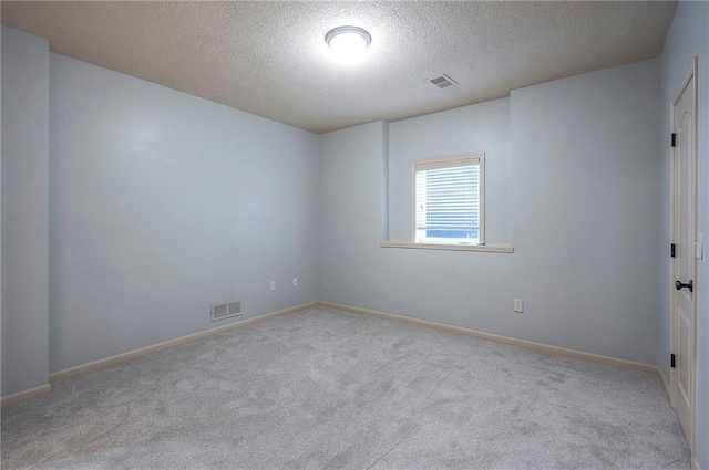 12337 Gillette St, Overland Park, KS 66213 - carpeted spare room featuring a textured ceiling and baseboards