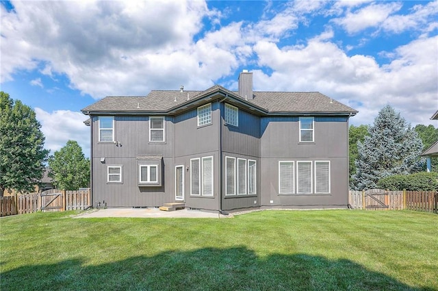 12337 Gillette St, Overland Park, KS 66213 - back of property featuring a gate, a patio area, a fenced backyard, and a chimney