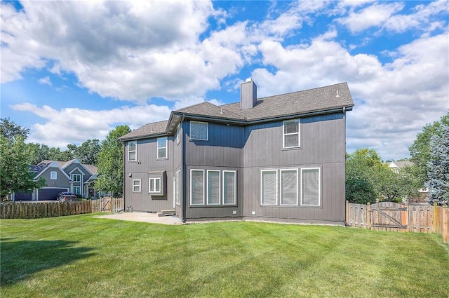 12337 Gillette St, Overland Park, KS 66213 - rear view of house with a gate, a chimney, a patio, and a fenced backyard