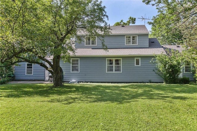 600 W Elm St, Olathe, KS 66061 - rear view of property with a yard