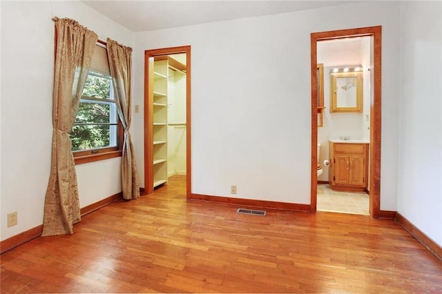 600 W Elm St, Olathe, KS 66061 - spare room featuring light wood finished floors and baseboards