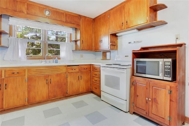 600 W Elm St, Olathe, KS 66061 - kitchen featuring stainless steel microwave, open shelves, white range with electric cooktop, and light flooring