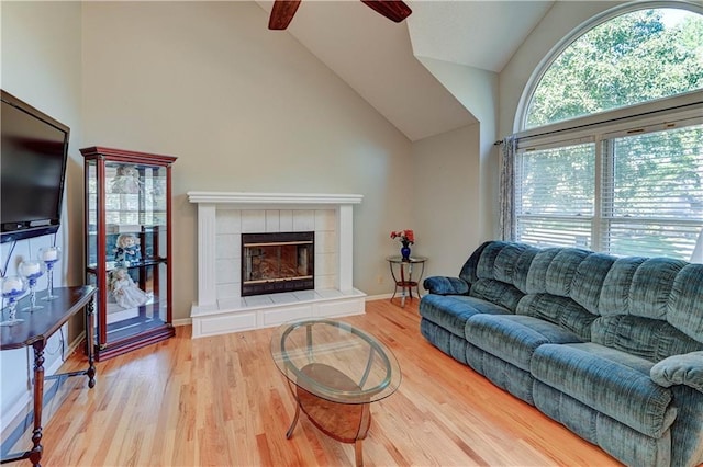6236 W 156th St, Overland Park, KS 66223 - living room with ceiling fan, wood finished floors, a fireplace, and high vaulted ceiling