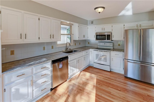 6236 W 156th St, Overland Park, KS 66223 - kitchen with stainless steel appliances, white cabinets, and light stone counters