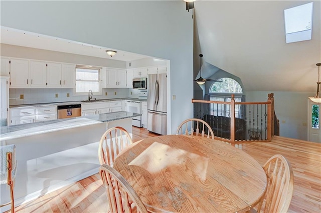 6236 W 156th St, Overland Park, KS 66223 - dining area featuring light wood finished floors, lofted ceiling, and ceiling fan