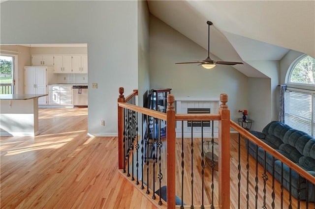 6236 W 156th St, Overland Park, KS 66223 - staircase featuring plenty of natural light, wood finished floors, ceiling fan, and high vaulted ceiling