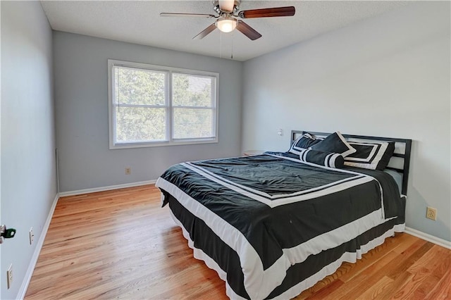 6236 W 156th St, Overland Park, KS 66223 - bedroom with light wood-style flooring, a ceiling fan, and a textured ceiling