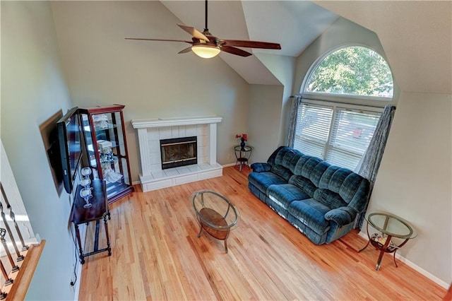 6236 W 156th St, Overland Park, KS 66223 - living room featuring ceiling fan, wood finished floors, a fireplace, and high vaulted ceiling