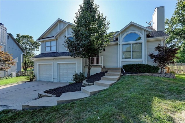 6236 W 156th St, Overland Park, KS 66223 - view of front of home featuring concrete driveway and a garage
