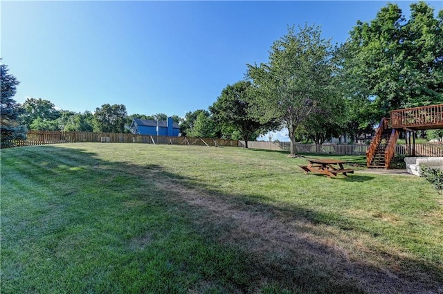 6236 W 156th St, Overland Park, KS 66223 - fenced backyard featuring stairs and a deck