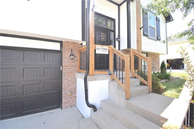 1207 SW 9th St, Oak Grove, MO 64075 - view of exterior entry with brick siding and an attached garage