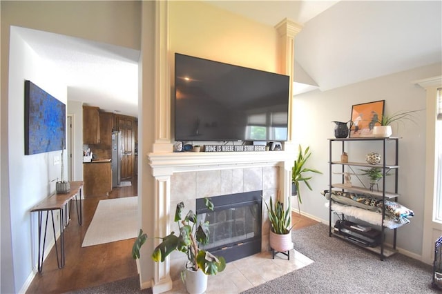 1207 SW 9th St, Oak Grove, MO 64075 - living area with lofted ceiling and a tile fireplace