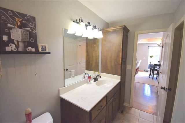 1207 SW 9th St, Oak Grove, MO 64075 - bathroom featuring a chandelier, vanity, and tile patterned floors