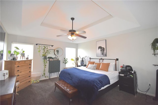 1207 SW 9th St, Oak Grove, MO 64075 - carpeted bedroom with a raised ceiling and a ceiling fan