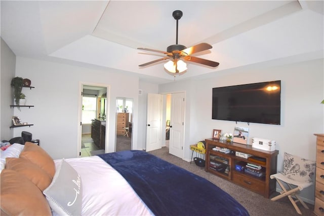 1207 SW 9th St, Oak Grove, MO 64075 - carpeted bedroom featuring a tray ceiling and a ceiling fan