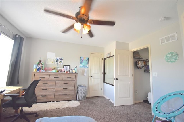 1207 SW 9th St, Oak Grove, MO 64075 - carpeted bedroom featuring an office area and a ceiling fan
