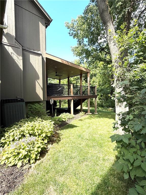 4531 Anderson St, Shawnee, KS 66226 - view of grassy yard with a wooden deck