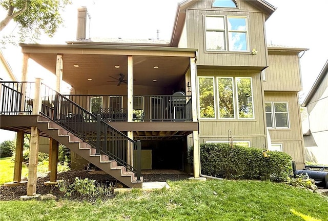 4531 Anderson St, Shawnee, KS 66226 - rear view of property with stairway, a yard, ceiling fan, and a chimney