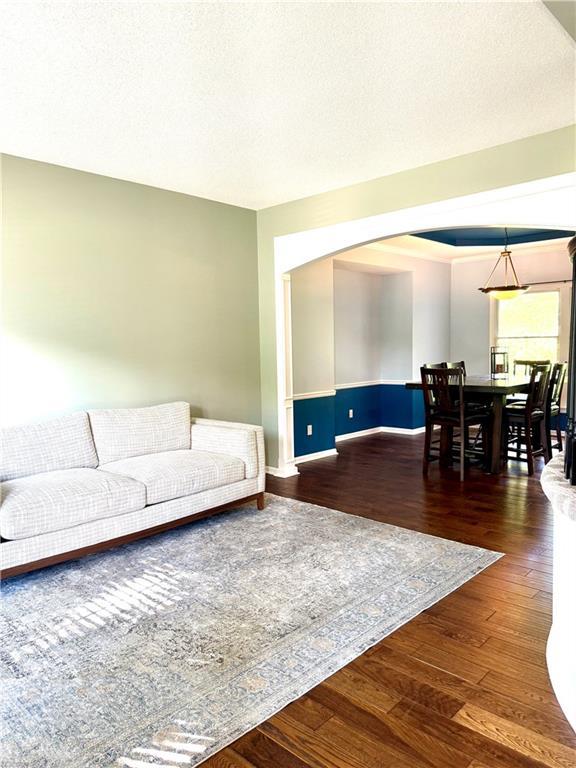 4531 Anderson St, Shawnee, KS 66226 - living room with wood finished floors and arched walkways
