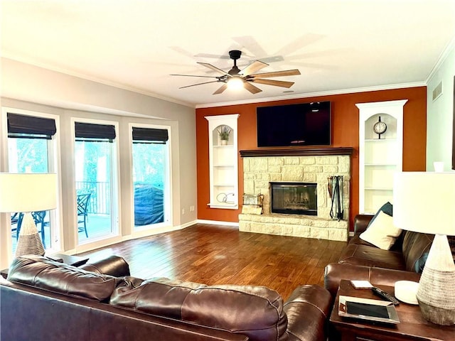 4531 Anderson St, Shawnee, KS 66226 - living room with crown molding, hardwood / wood-style flooring, a ceiling fan, built in shelves, and a fireplace